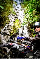 waterfall and motorcyclist