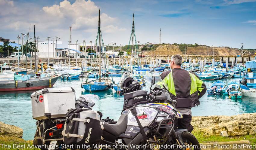 Man with Suzuki VStrom 1000 Adventure Motorcycle Looking at harbor in Manta Ecuador