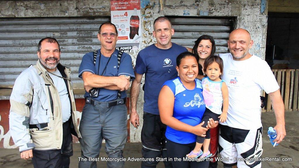 happy motorcycle tour riders with hapy ecuadorians
