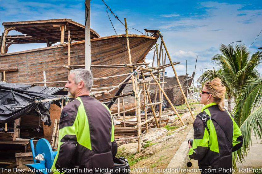 two motorcyclists admiring the wood boatbuilders in manta ecuador