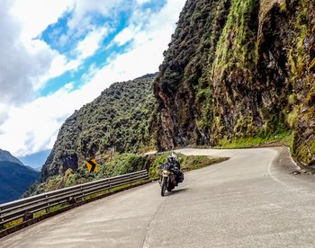 riding adventure motorcycle in sangay national park in ecuador