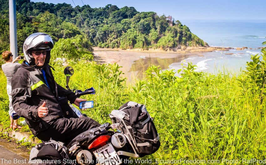 motorcyclist overlooking secluded beach in northern Ecuador