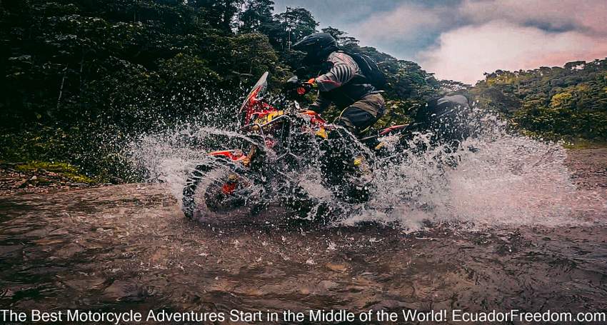 a honda africa twin doing a river crossing in ecuador on a dual sport motorcycle tour