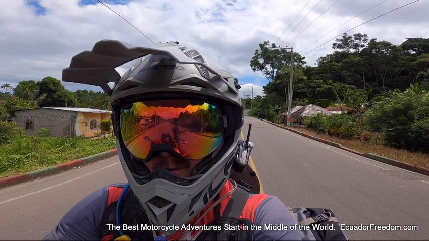 a motorcyclist in ecuador leading a tour with a cardo packtalk bold communicator on his helmet