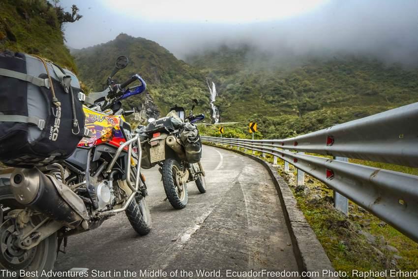 Motorcycles on a tour in ecuador with waterfall 