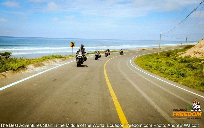 group of 4 motorcycles on a paved road on along the pacific coast of Ecuador