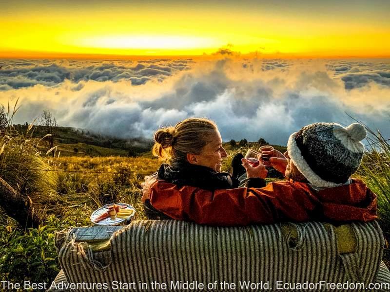 happy married couple enjoying a glass of wine and a sunset in ecuador