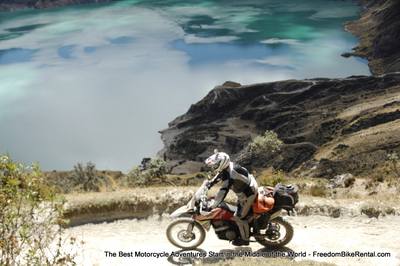 motorcycle riding on the rim of the Quilotoa Crater Lake on dirt road
