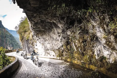 Riding under the cliffs near Rio Verde Ecuador