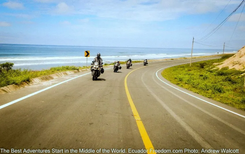four motorcycles riding along the pacific coast in ecuador