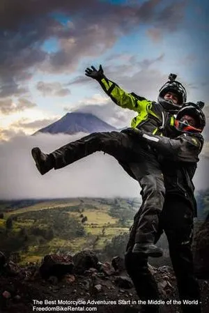 happy motorcyclists at tungurahua volcano in ecuador