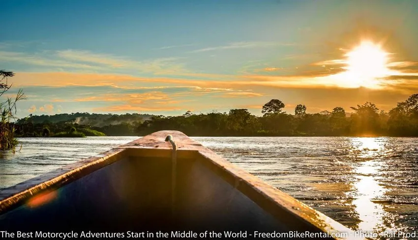 riding in a motorized canoe on the napo river in the ecuador amazon jungle