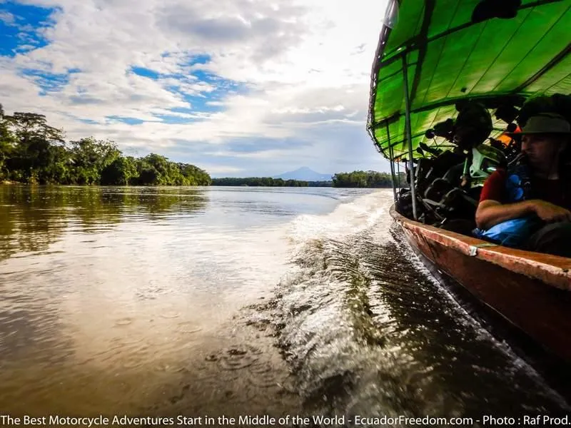 motorcycles in a canoe in the Amazon jungle