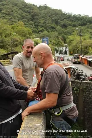 bridge swing jump on klim motorcycle adventure tour in ecuador team building