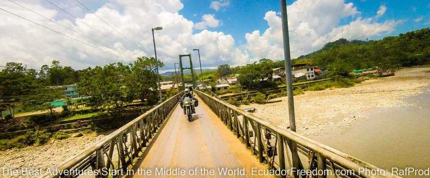 crossing the bridge in misahualli napo ecuador motorcycle adventure tour