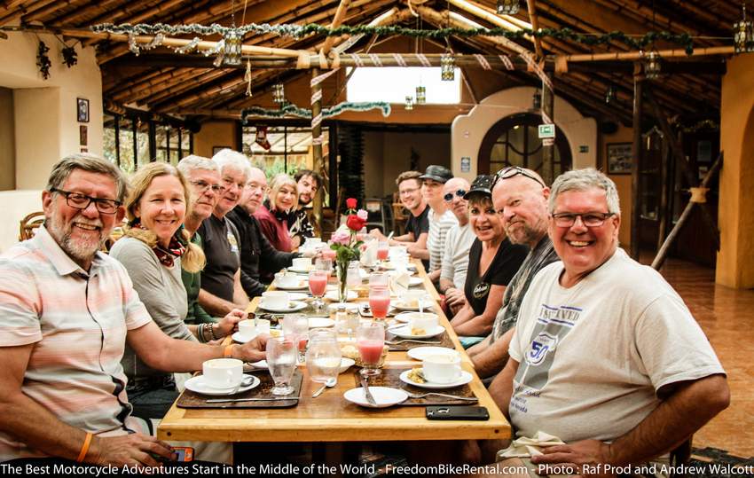 motorcycle tour group eating in a restaurant together in Ecuador