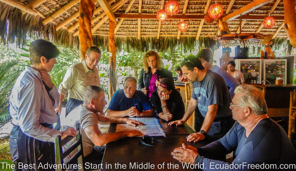 Going over the map with motorcycle tour participants in ecuador