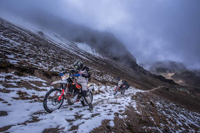 riding two dual sport motorcycles up to guagua pichincha volcano in quito ecuador on a dirt bike city tour